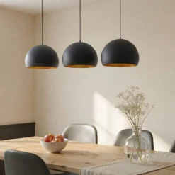 Lindby Pendellampe Tarjei, 146 cm lang, schwarz/gold, Metall