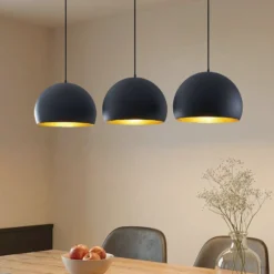 Lindby Pendellampe Tarjei, 146 cm lang, schwarz/gold, Metall