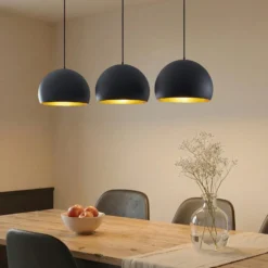 Lindby Pendellampe Tarjei, 146 cm lang, schwarz/gold, Metall